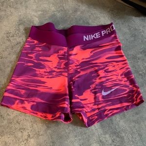 Purple and pink Nike Pro